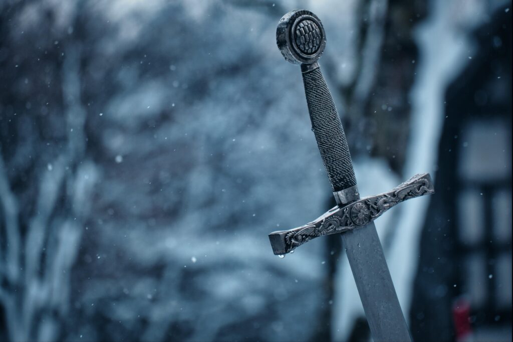 The hilt of a cruciform sword in winter